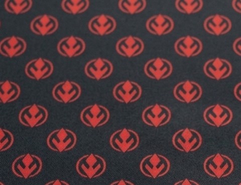 Pattern of red symbols on a black background