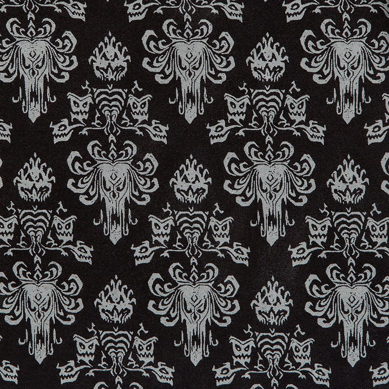 Patterned fabric with white designs on a black background