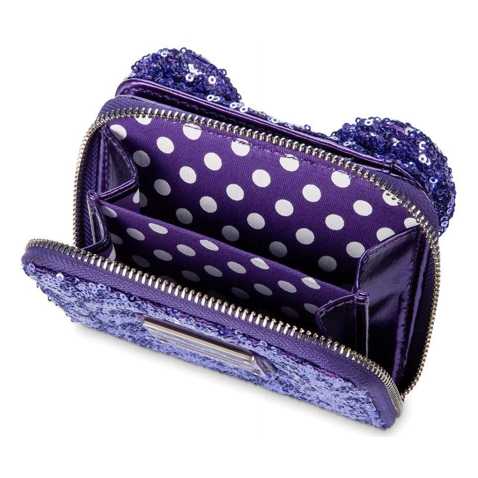 Purple polka dot handbag on a white background