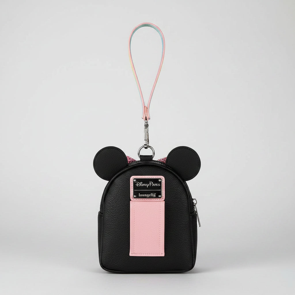 Black backpack with Mickey Mouse ears and a pink patch on a white background