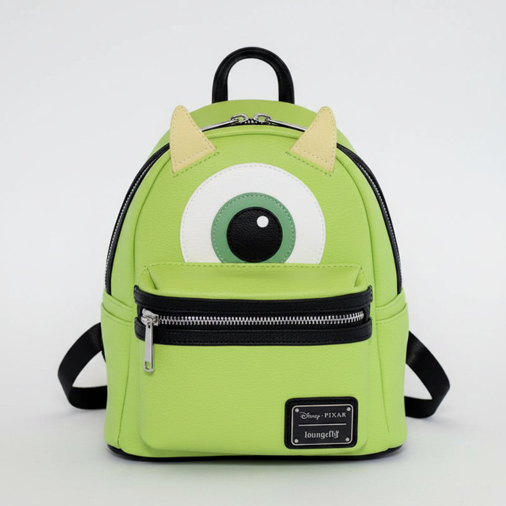 Green backpack with cartoonish design on a white background