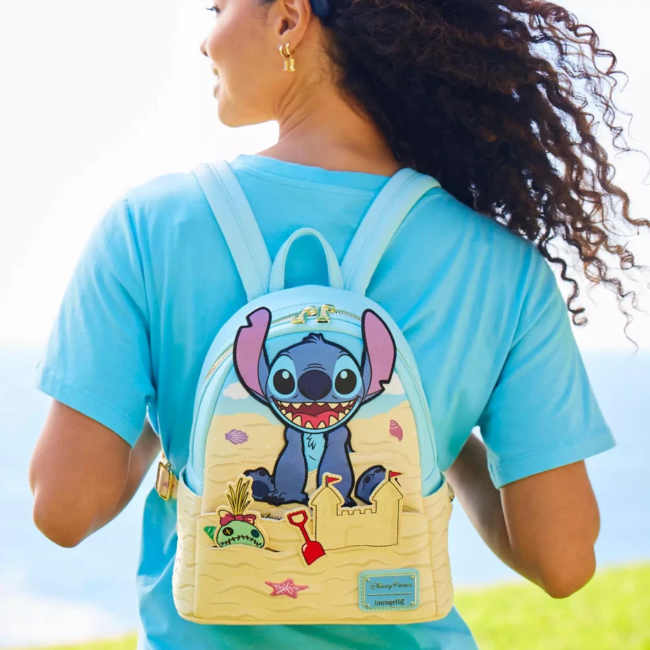 Person wearing a blue shirt with a cartoon character backpack outdoors